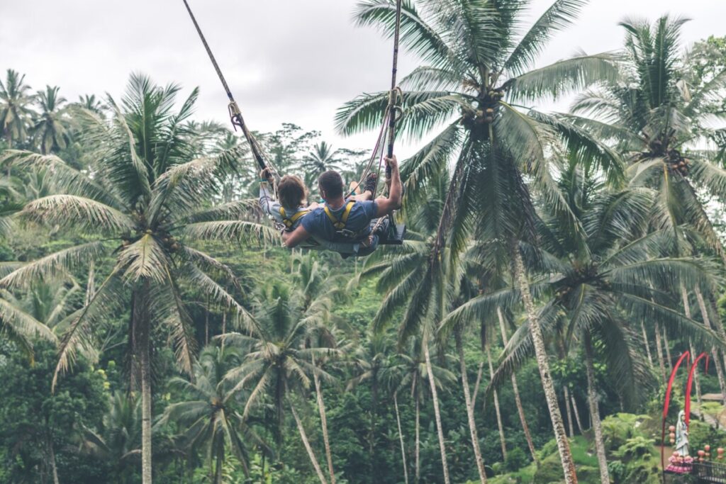 A couple in Bali on a swing